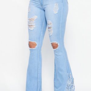 Light colored distressed fringy jeans